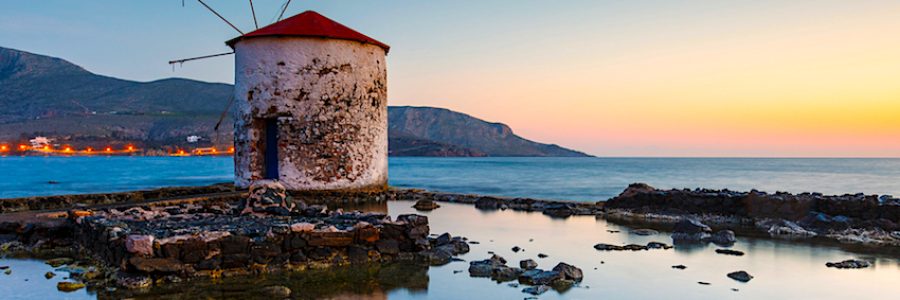 Sunrise landscape with a windmill in Agia Marina village on Leros island in Greece.